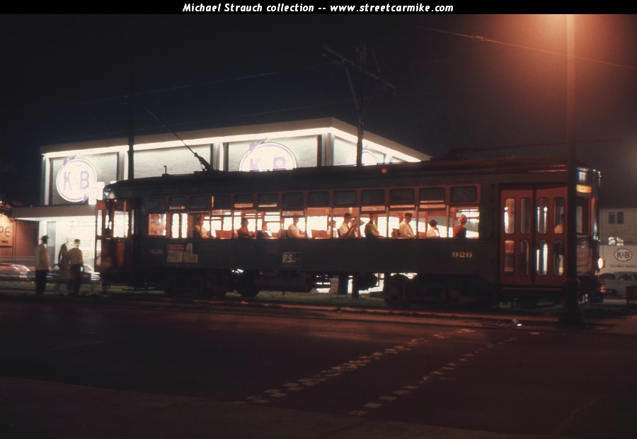 Car 926 inbound at St. Charles and Louisiana Aves. at night about 1969 in a...